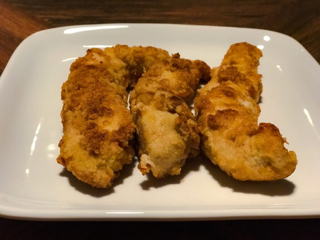 almond flour fried chicken tenders served on a plate