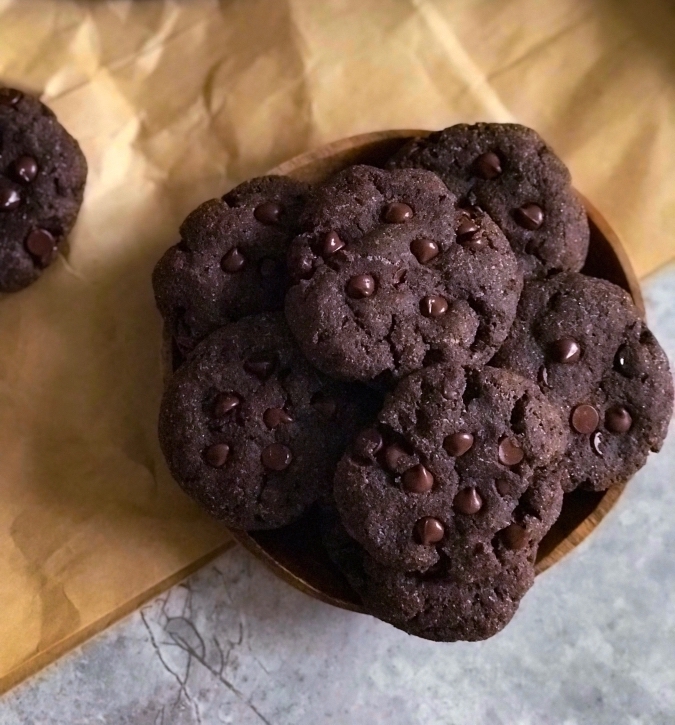 close up view of double chocolate chip cookies in a bowl