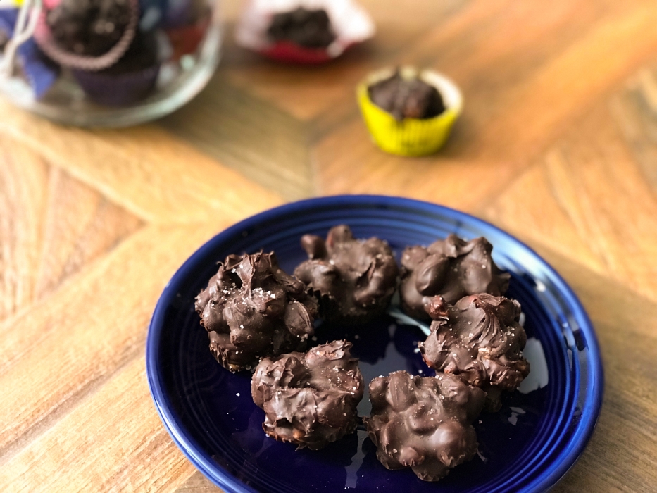 view of chocolate covered peanut clusters on a plate
