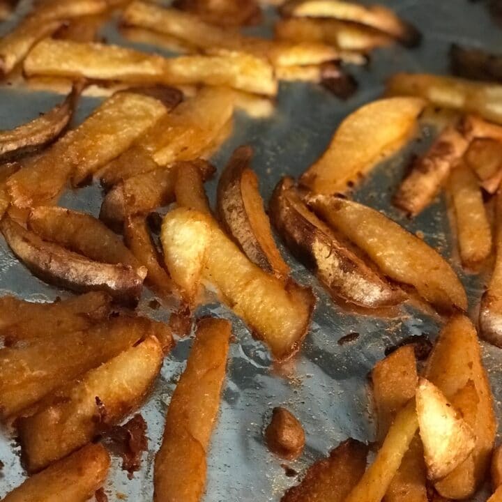 Crispy jicama French fries on a sheet pan