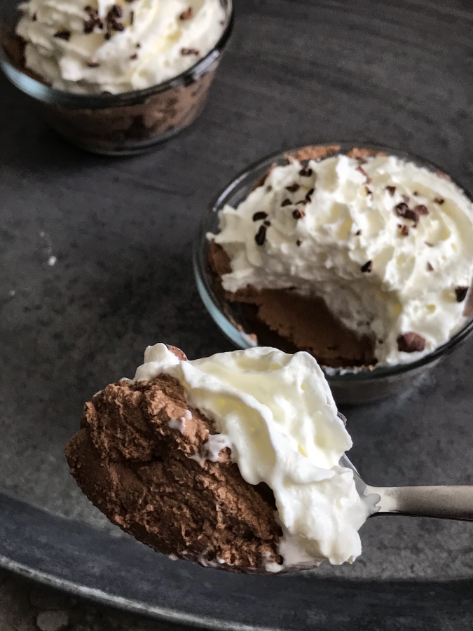 A bite of chocolate mousse on a spoon