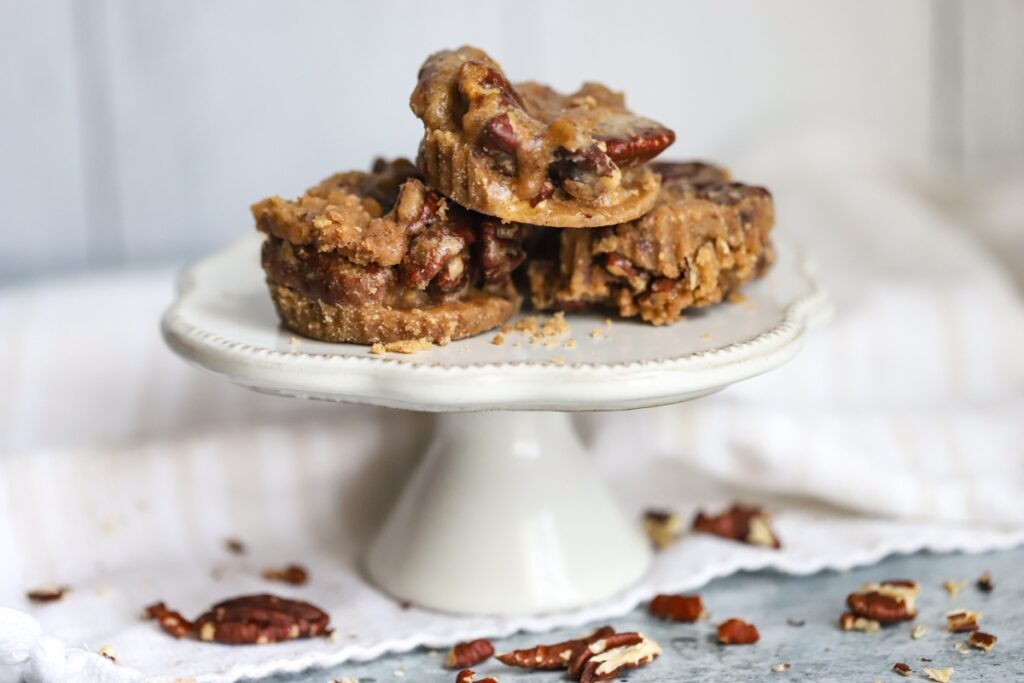 pecan pralines in the center on top of mini cake stand