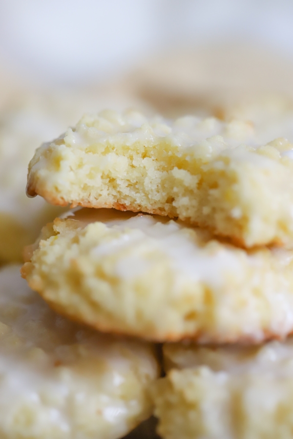 closeup of lemon cookies without on top of others and a bite taken out of it
