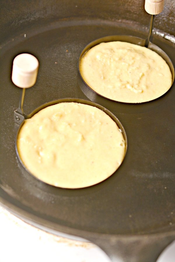 two pancakes being made in a skillet