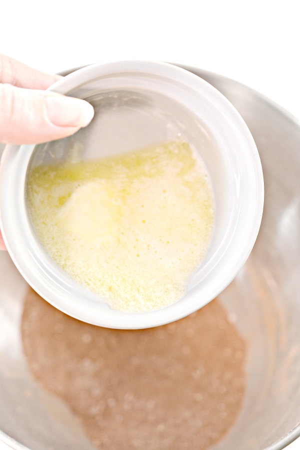 melted butter being poured into the mixing bowl