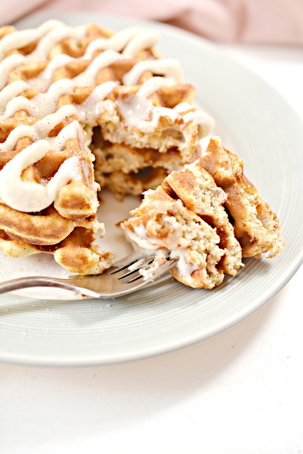 cut into cinnamon roll chaffles with the piece on a fork
