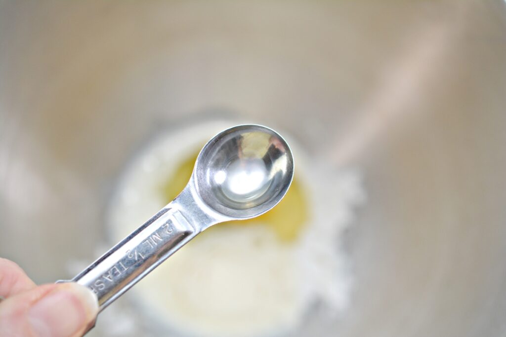 teaspoon of lemon extract over a mixing bowl