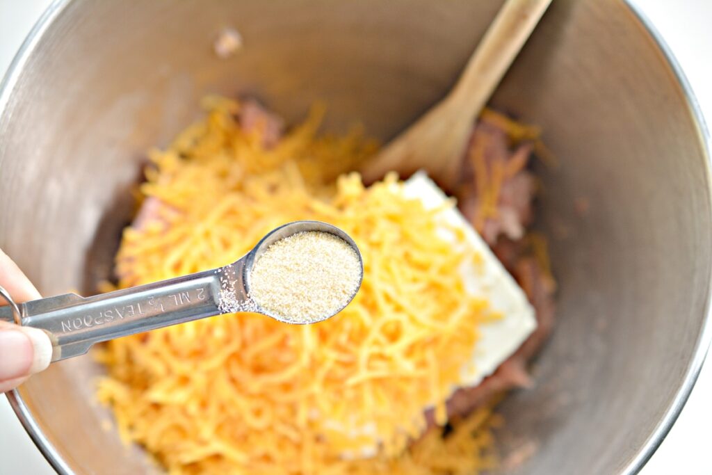 teaspoon of garlic powder over a mixing bowl