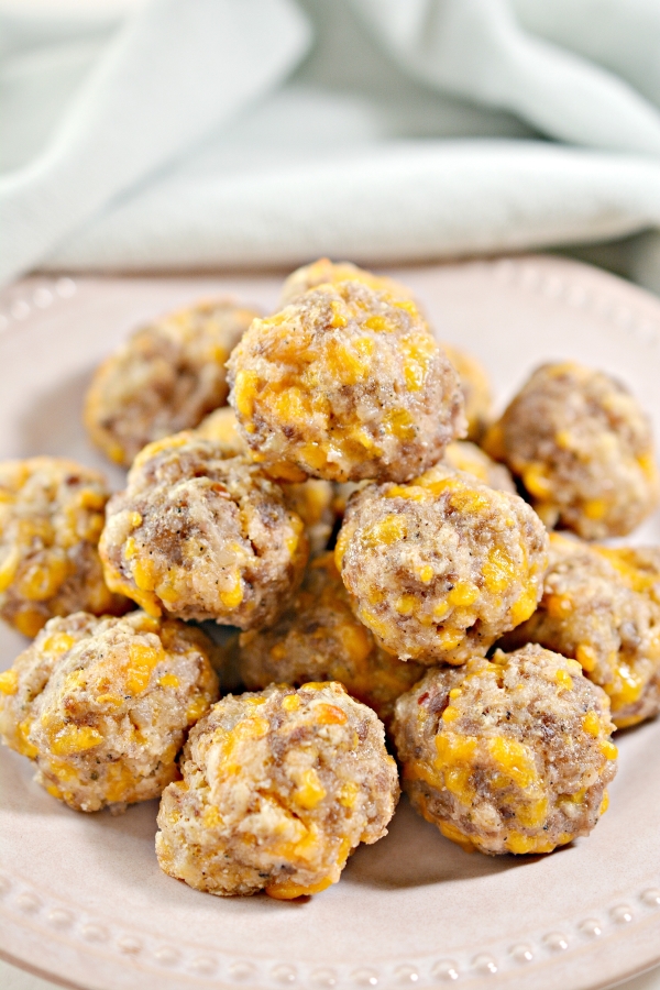 close up view of keto sausage balls on a plate