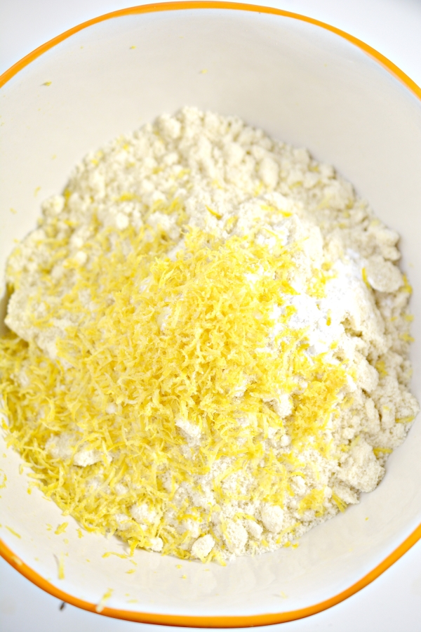 adding lemon zest into mixing bowl