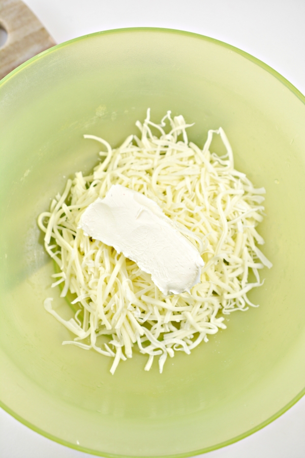 mozzarella and cream cheese in a mixing bowl