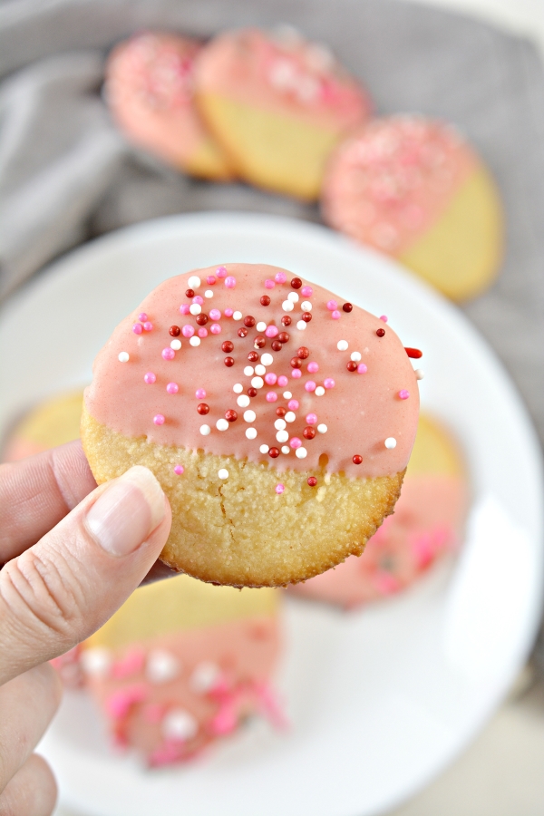 holding up one valentines day keto cookie