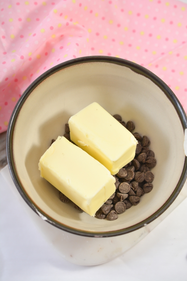 butter stick and milk chocolate in a baking dish