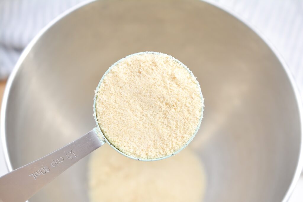 almond flour going into a mixing bowl
