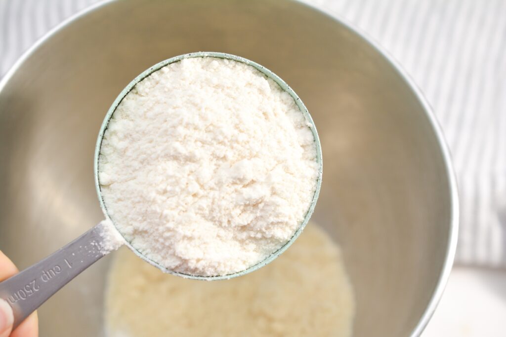 coconut flour going into a mixing bowl
