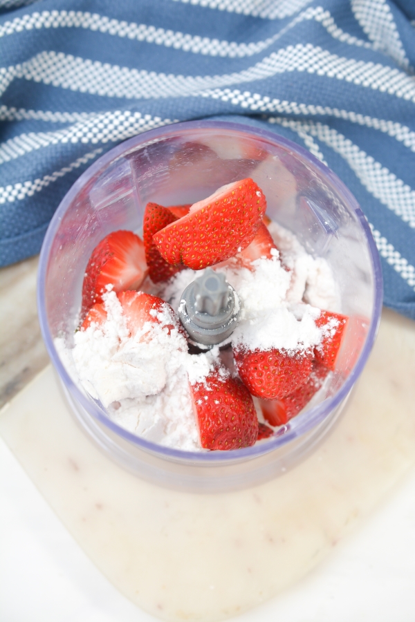 ingredients for strawberry topping in a blender