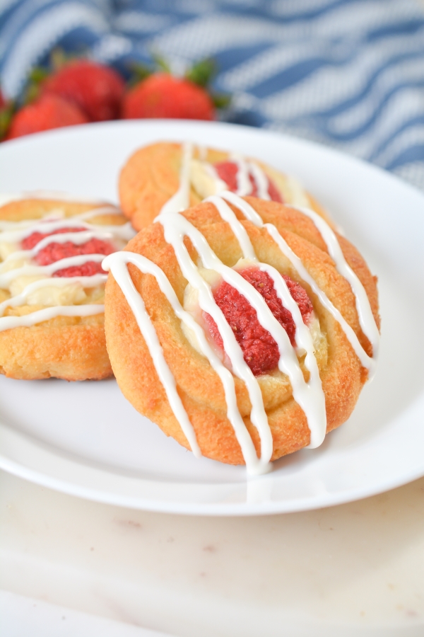 strawberry keto danishes on a plate with one in the front