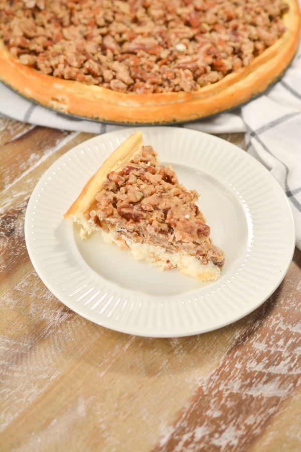 slice of keto pecan pie cheesecake on a plate 