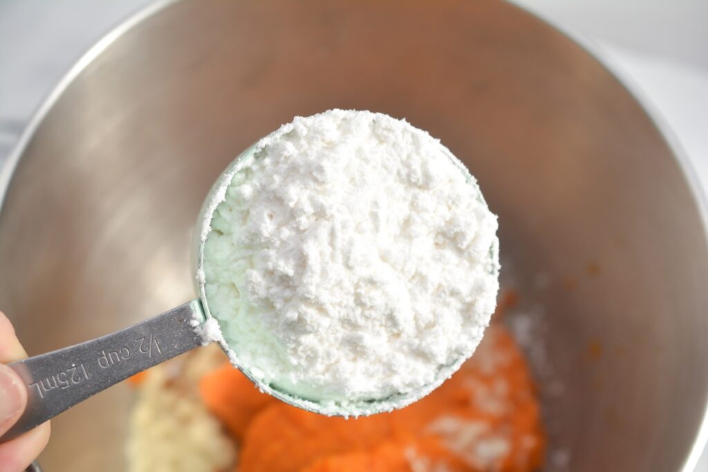 powdered sweetener over mixing bowl