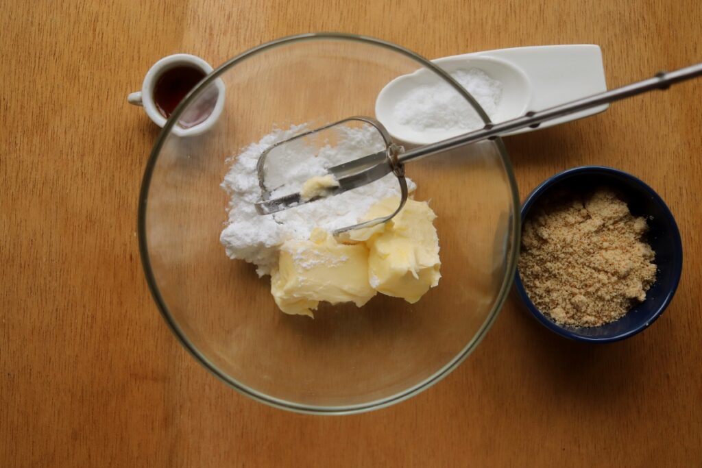 powdered sweetener and butter in mixing bowl