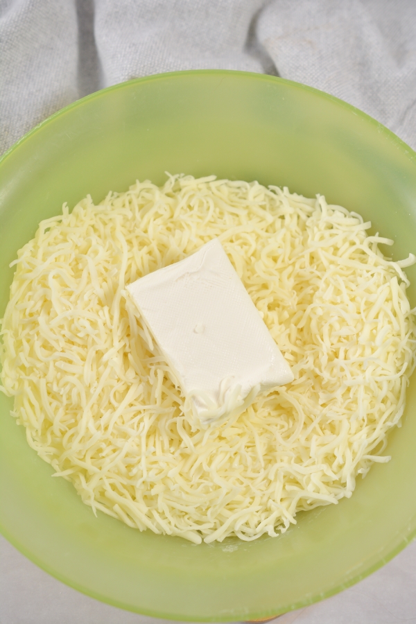 mozzarella cheese and cream cheese in mixing bowl